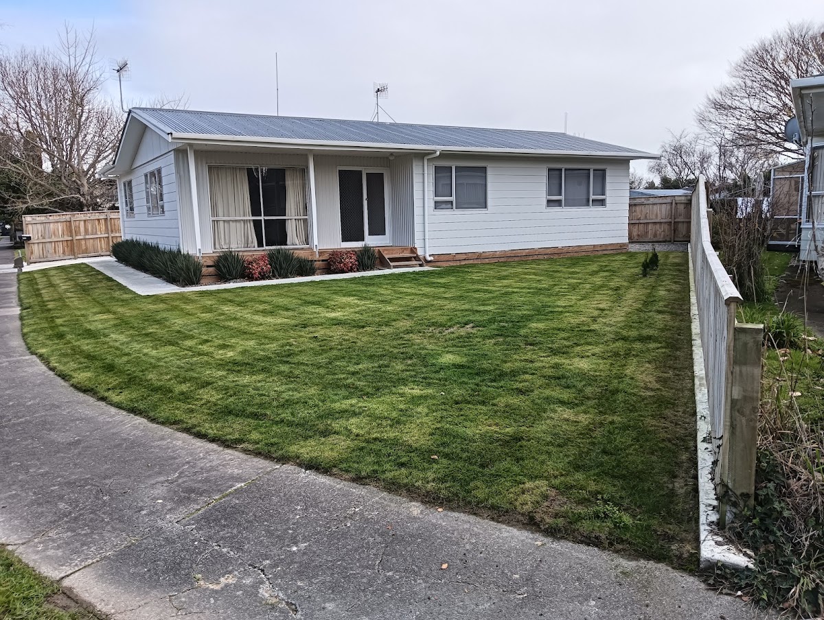 Freshly striped front lawn at a Palmerston North weatherboard home